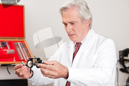 Image of Optometrist Examining Trial Frame For Eye Test