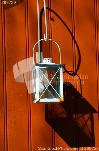 Image of Lantern on wall in sunshine