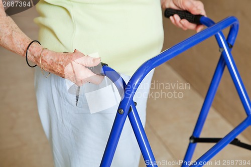 Image of Senior Woman Using Walker