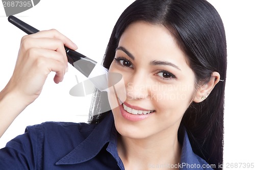 Image of Woman Applying Cosmetic Paint Brush