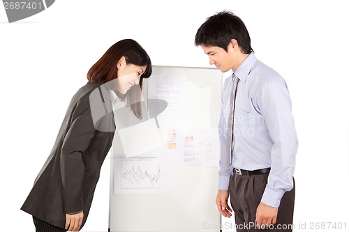Image of Businesswoman And Businessman Greeting