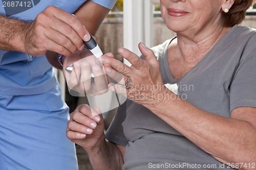 Image of Doctor taking a Blood Sample