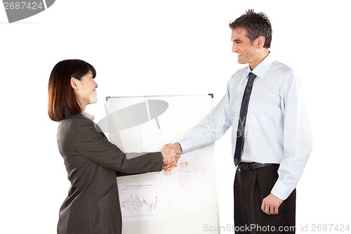 Image of Businesswoman And Businessman Shaking Hand