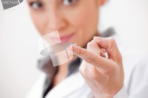 Image of Optometrist Showing Contact Lens