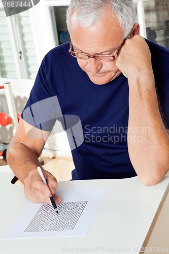 Image of Man Playing Puzzle Game