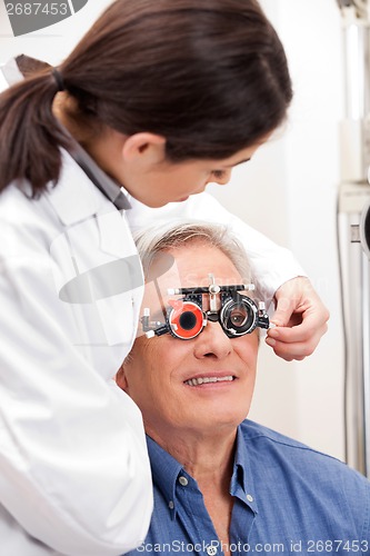 Image of Man Wearing Trial Frames For Eye Treatment