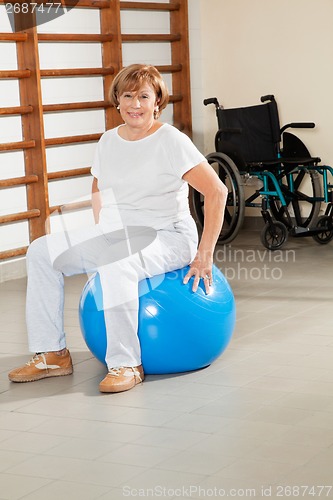 Image of Senior Woman Sitting On Fitness Ball