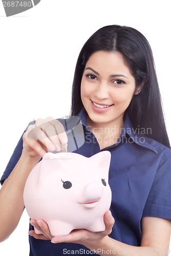 Image of Smiling Woman Holding Piggy Bank