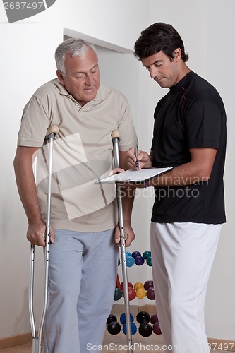 Image of Patient on Crutches and Physician