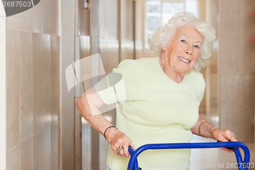 Image of Happy Senior Woman Using Zimmer Frame