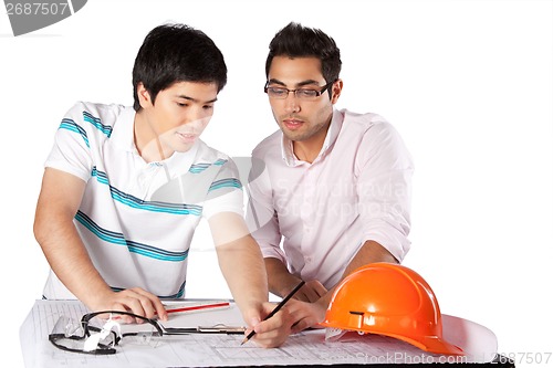 Image of Two Architects Discussing on Blueprints