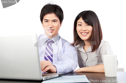 Image of Businessman and Businesswoman at Work