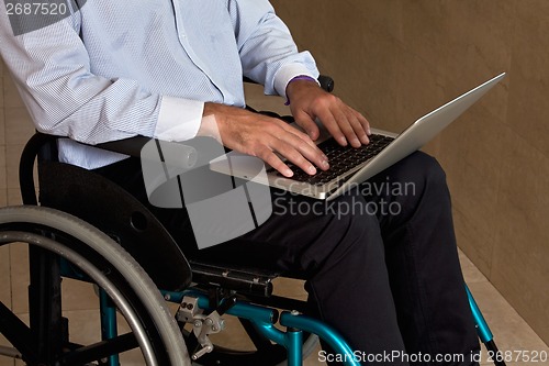 Image of Man on Wheelchair Using Laptop