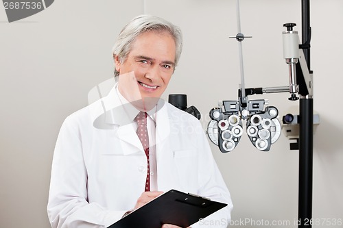 Image of Smiling Optometrist With Notepad