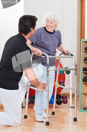 Image of Woman With Walker Looking At Trainer