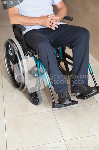 Image of Low Section Of a Senior Man Sitting In a Wheelchair