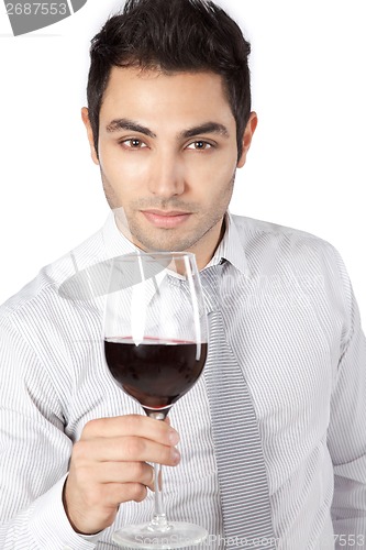 Image of Businessman Holding Red Wine Glass