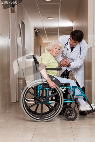 Image of Doctor with Patient on Wheel Chair