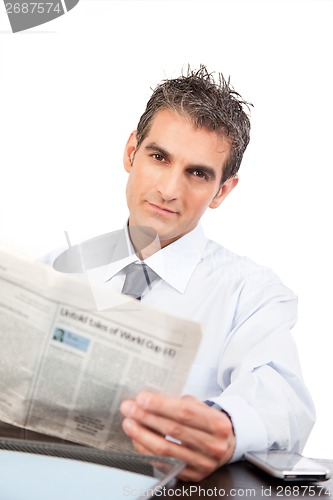 Image of Businessman Reading a Newspaper