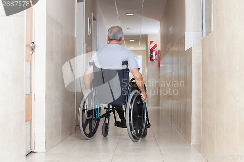 Image of Senior Man Sitting In a Wheelchair