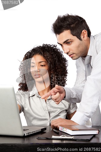 Image of Businessman and Businesswoman Using Laptop