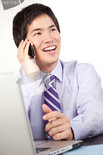 Image of Businessman Talking on Cell Phone