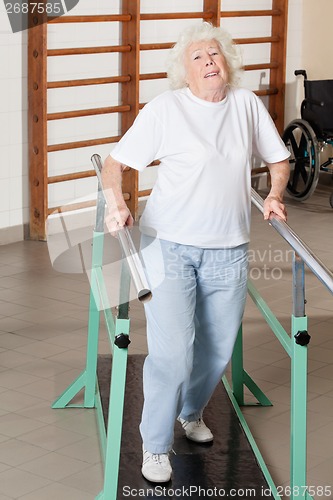 Image of Tired Senior Woman On Walking Track