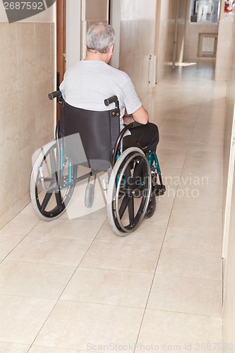 Image of Retired Man on Wheelchair