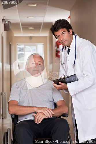 Image of Doctor with Patient in Wheelchair