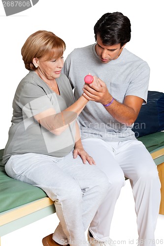 Image of Therapist Giving Muscle Training Over White Background