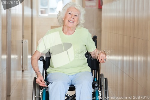 Image of Happy Senior Woman Sitting In a Wheel Chair