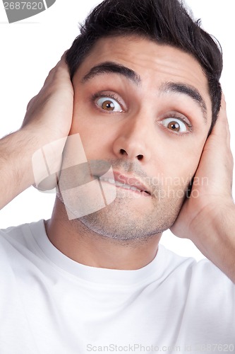 Image of Young Asian Man Covering Ears