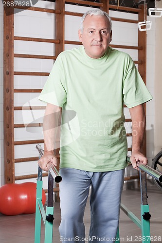 Image of Senior Man having ambulatory therapy