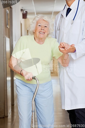 Image of Doctor Assisting Senior Woman