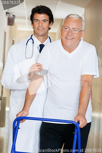 Image of Doctor Helping An Old Man With His Walker