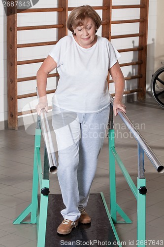 Image of Mature Woman having ambulatory therapy