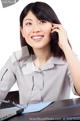 Image of Businesswoman Talking on Cell Phone