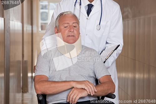 Image of Doctor with Patient in Wheelchair