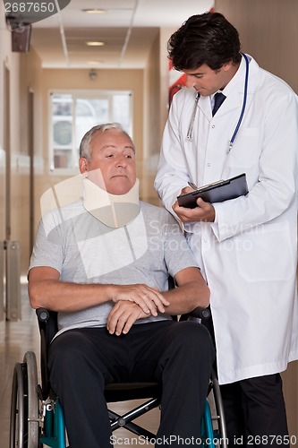 Image of Doctor with Patient in Wheelchair