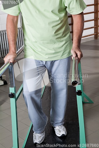 Image of Senior Man having ambulatory therapy