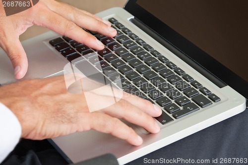 Image of Hands Typing On Keyboard