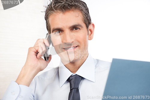 Image of Businessman Talking On Cell Phone