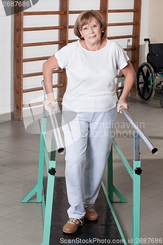 Image of Mature Woman having ambulatory therapy