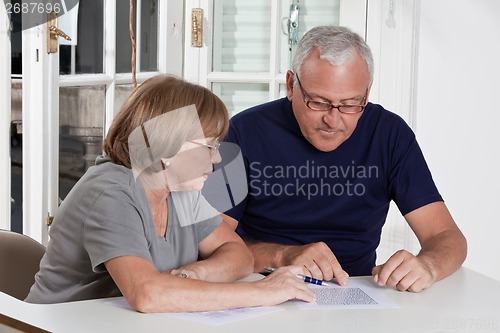 Image of Mature Couple playing Scrabble Game