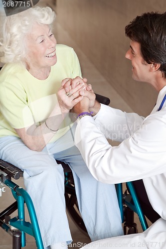 Image of Doctor with Patient on Wheel Chair