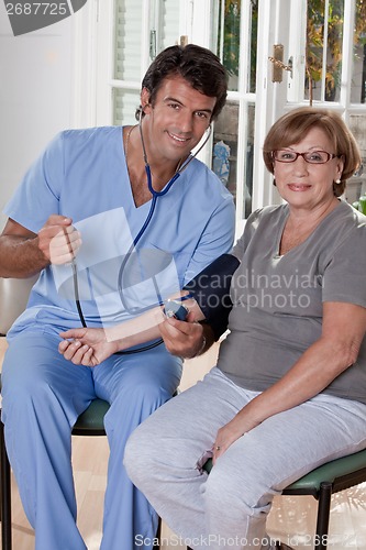 Image of Doctor taking the Blood Pressure