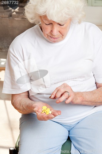 Image of Woman Looking At Tablets