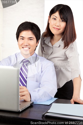 Image of Businessman and Businesswoman at Work
