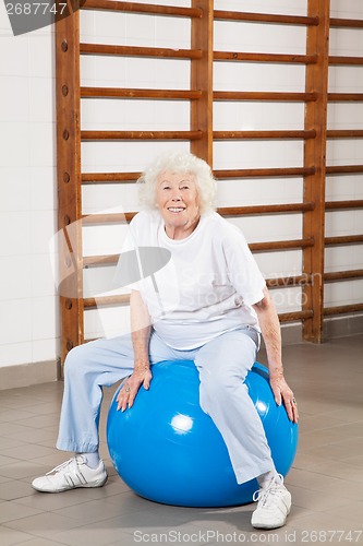 Image of Happy Senior Woman Sitting On Fitness Ball