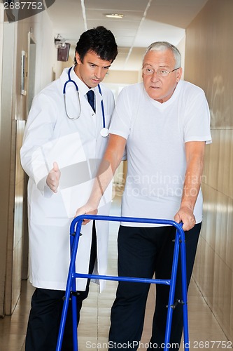 Image of Doctor Assisting Senior Man On a Walker